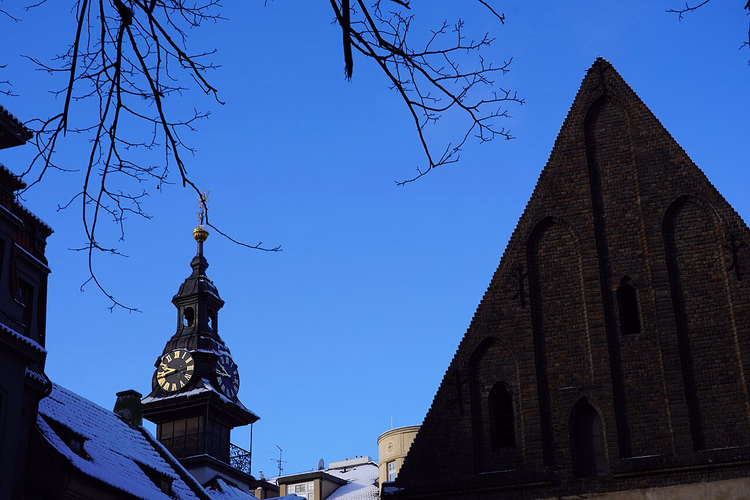 Old New Synagogue and town hall tower in winter