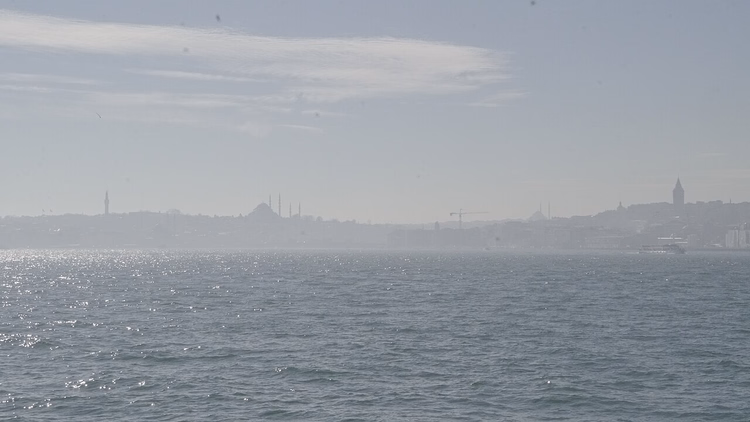 Panorama of Istanbul over the hazy strait water