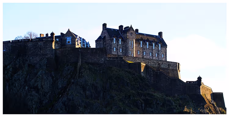 Edinburgh Castle on its rock in low sunlight