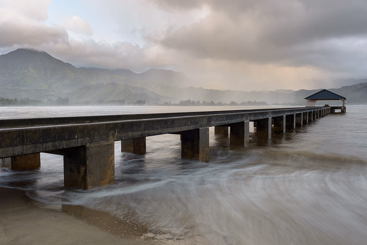 Hanalei Pier and Kauai mountains in the clouds