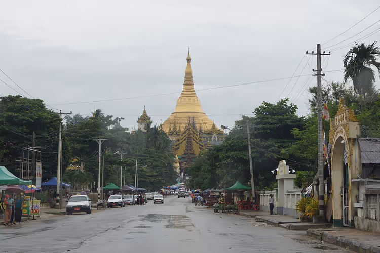Yangon street with the golden Shwedagon Pagoda in the distance
