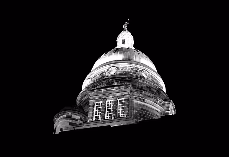 Illuminated dome of Old College in Edinburgh at night