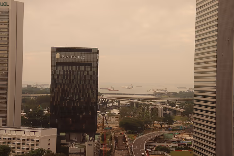 Singapore skyline with Pan Pacific hotel from window