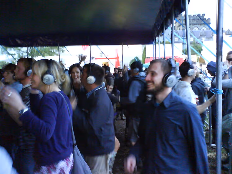 Crowd in headphones at a silent disco