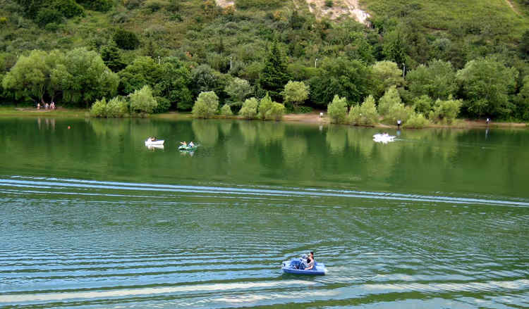Boats on the green surface of Turtle Lake