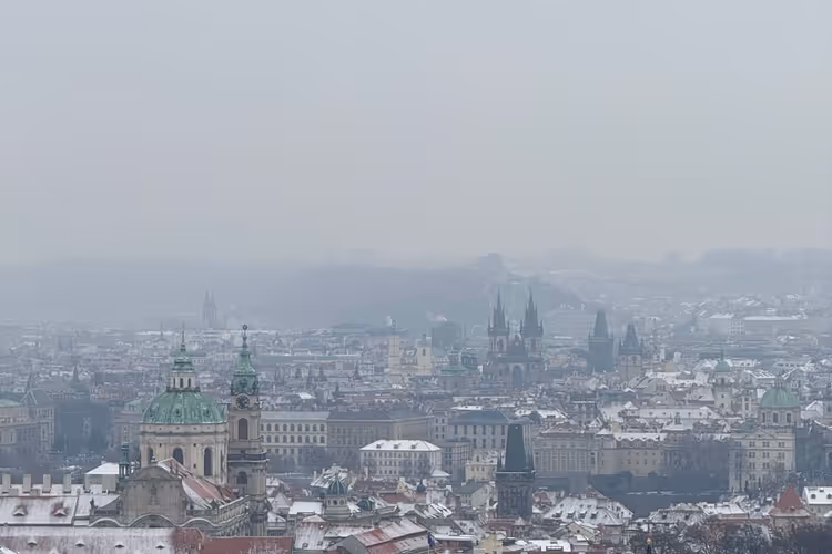Winter panorama of Prague with snowy rooftops