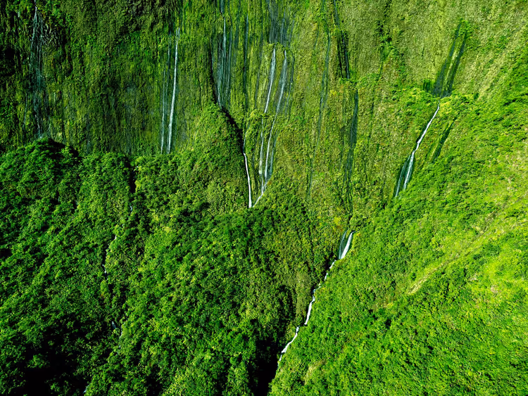 Green cliffs with waterfalls, aerial view