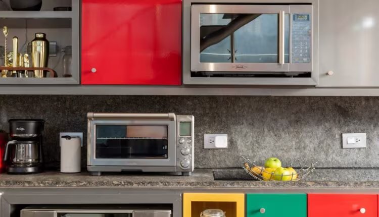 silver microwave oven on black marble counter top
