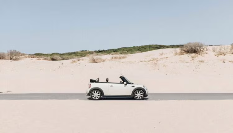 convertible coupe in middle of road