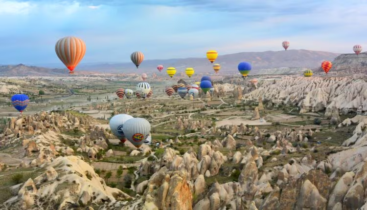 photo of assorted-color air balloon lot in mid air during daytime