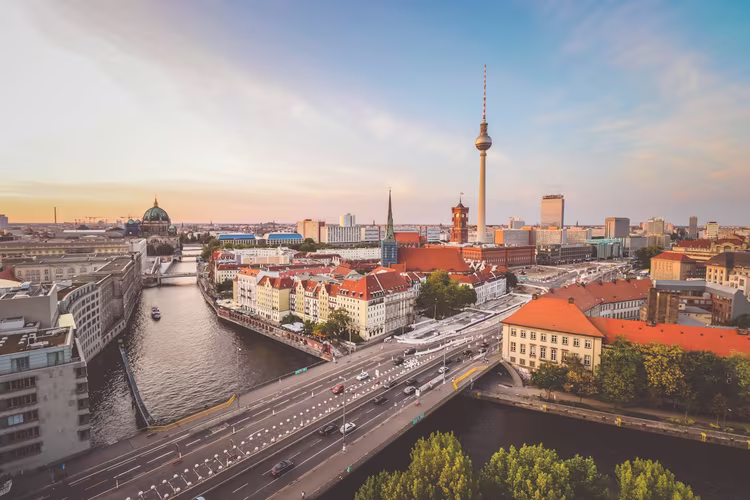 Berlin street scene, local services, Berlin travel 📸 Realistic photo of pedestrians crossing a vibrant Berlin street with cafes and trams in view. Berlin Street