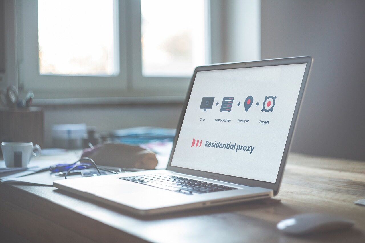 mobile proxy usage, analytics 📸📸 Realistic photo of a laptop showing analytics dashboard with a smartphone nearby connected to network, soft lighting, modern workspace Mobile proxy usage