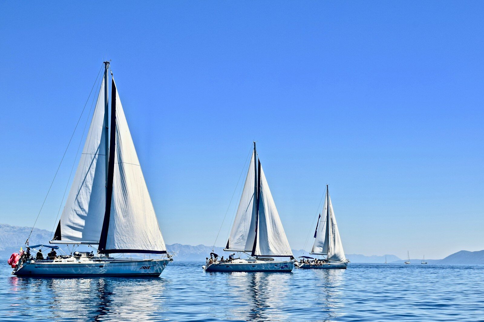 Ionian Islands sailing, hidden bay, Greece yacht charter 📸📸 Realistic photo of a sailing yacht in a secluded Ionian cove with transparent water, limestone rocks, pine trees, no crowds, cinematic summer light 📸📸 Hidden bay in the Ionian