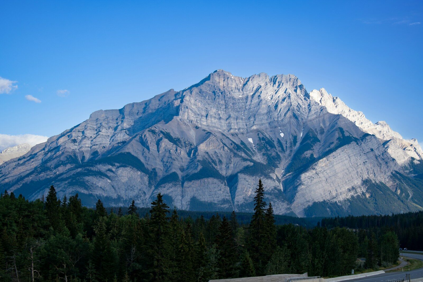 Remote highway through Canadian forest and mountains